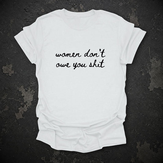 Women Don’t Owe You Shit Feminist T-Shirt in White, flat lay mockup