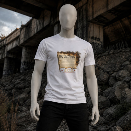 White We the People Burn T-shirt on a matte white mannequin beneath an urban overpass